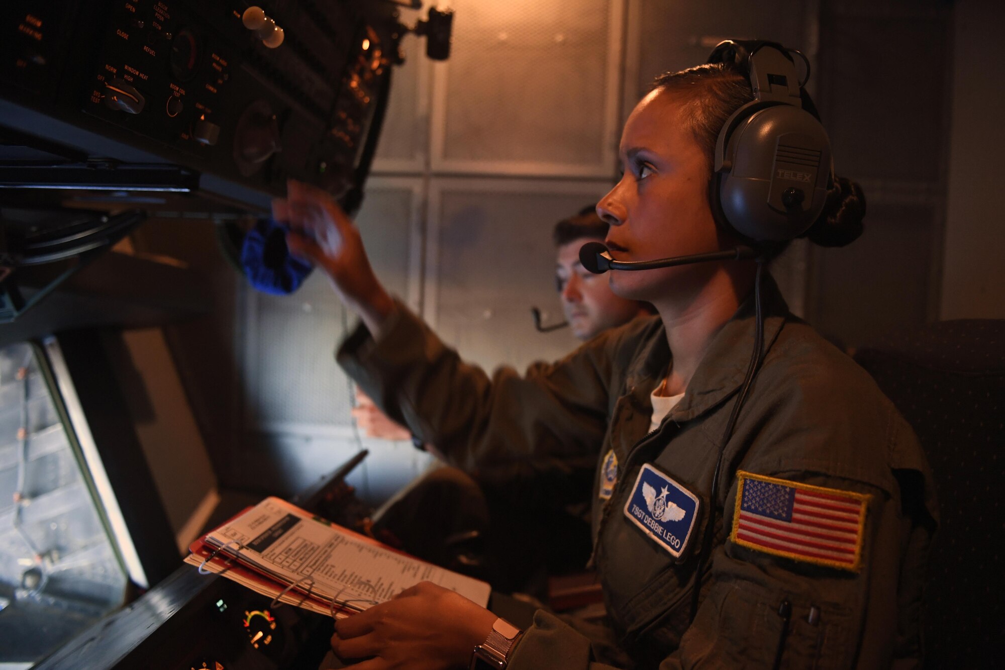 Tech Sgt. Debbie Lego, a KC-10 boom operator with the 32d Air Refueling Squadron, facilitates the safe transfer of fuel to a C-17 Globemaster III en route from Alaska to Australia during Talisman Saber 17. More than 80,000 pounds of fuel was offloaded to each of the C-17 by the KC-10 fleet.