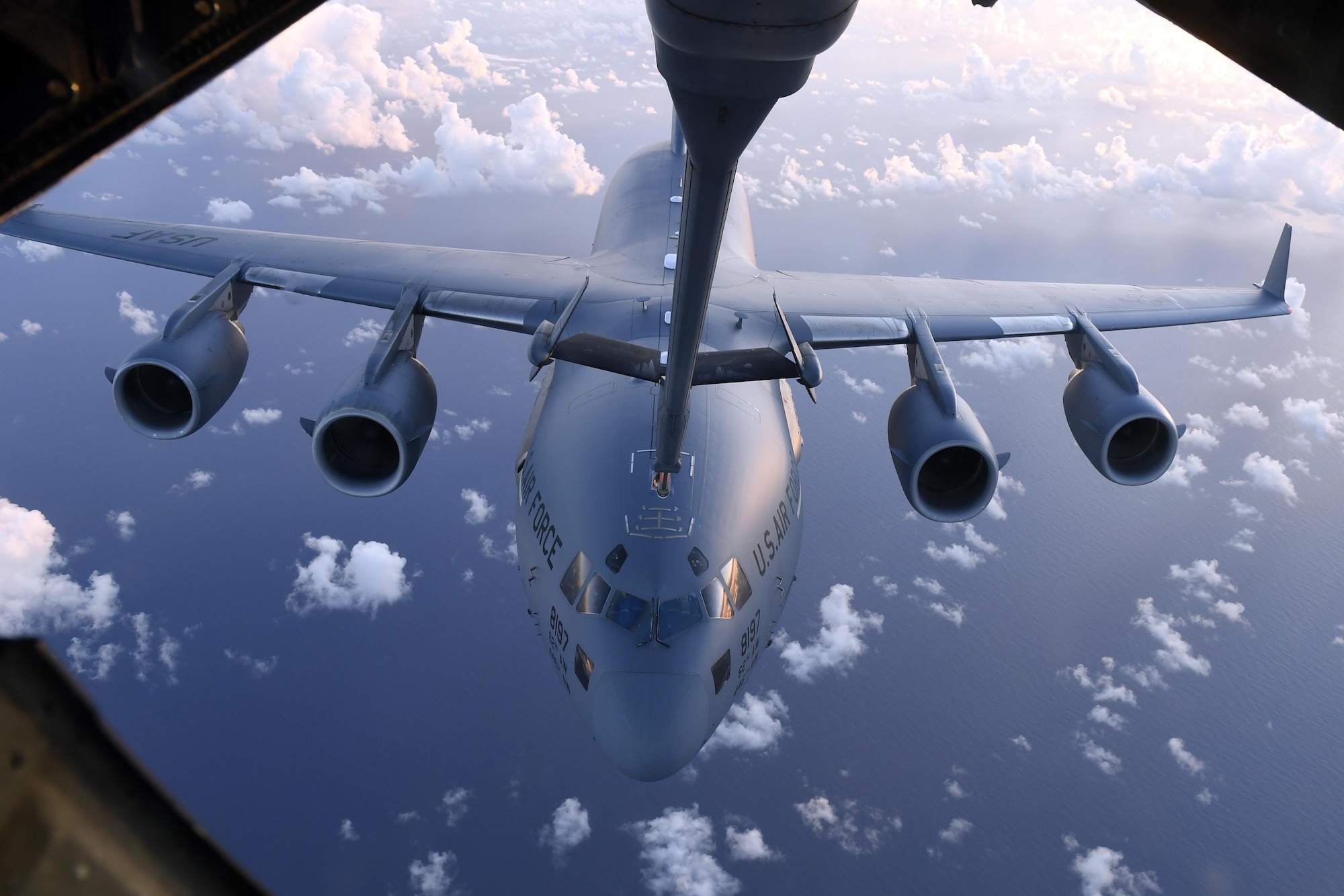 A C-17 Globemaster III receives fuel from a KC-10 Extender over the Pacific Ocean during Talisman Saber 17, July 11. The C-17 aircraft flew from Alaska to Australia in a single continuous, 17-hour flight, relying on the fuel provided by tankers from Travis Air Force Base, California, and Joint Base McGuire-Dix-Lakehurst, New Jersey.