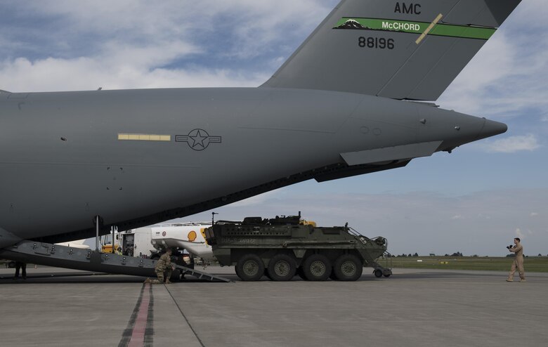 A U.S. Army 2nd Cavalry Regiment Interim Armored Vehicle Stryker drives out of a U.S. Air Force C-17 Globemaster III at Plovidv Airport, Bulgaria, July 14, 2017. U.S. Air Forces in Europe airlift will also deliver Stryker vehicles in support of upcoming exercises Swift Response 17-1 and Saber Guardian 17.  These U.S. led multinational exercises ensure high readiness forces can respond to any threat or crisis in a timely manner. (U.S. Air Force photo by Senior Airman Tryphena Mayhugh)