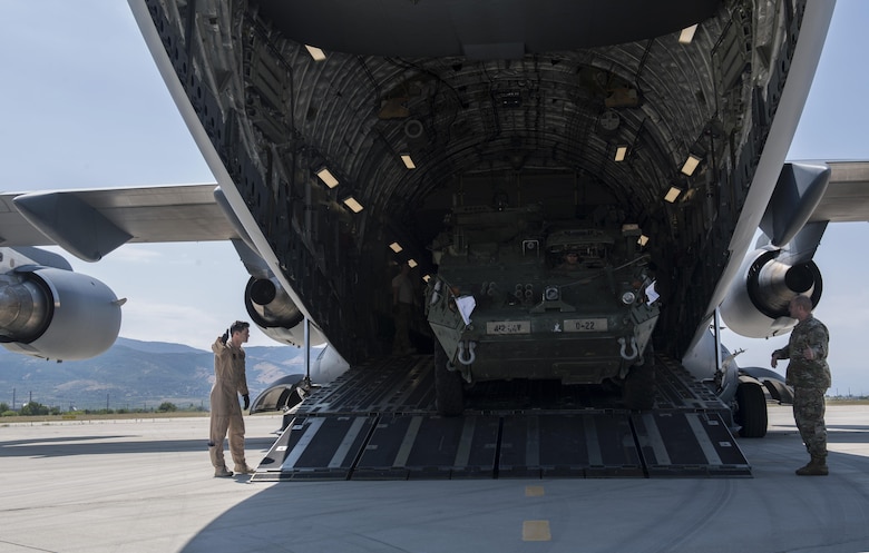 A U.S. Army 2nd Cavalry Regiment Interim Armored Vehicle Stryker drives out of a U.S. Air Force C-17 Globemaster III at Plovdiv Airport, Bulgaria, July 14, 2017. Delivering Stryker vehicles to Bulgaria is an example of how assets are ready and postured to assure, deter, and respond as a joint and combined team in the event a U.S. response is required. (U.S. Air Force photo by Senior Airman Tryphena Mayhugh)