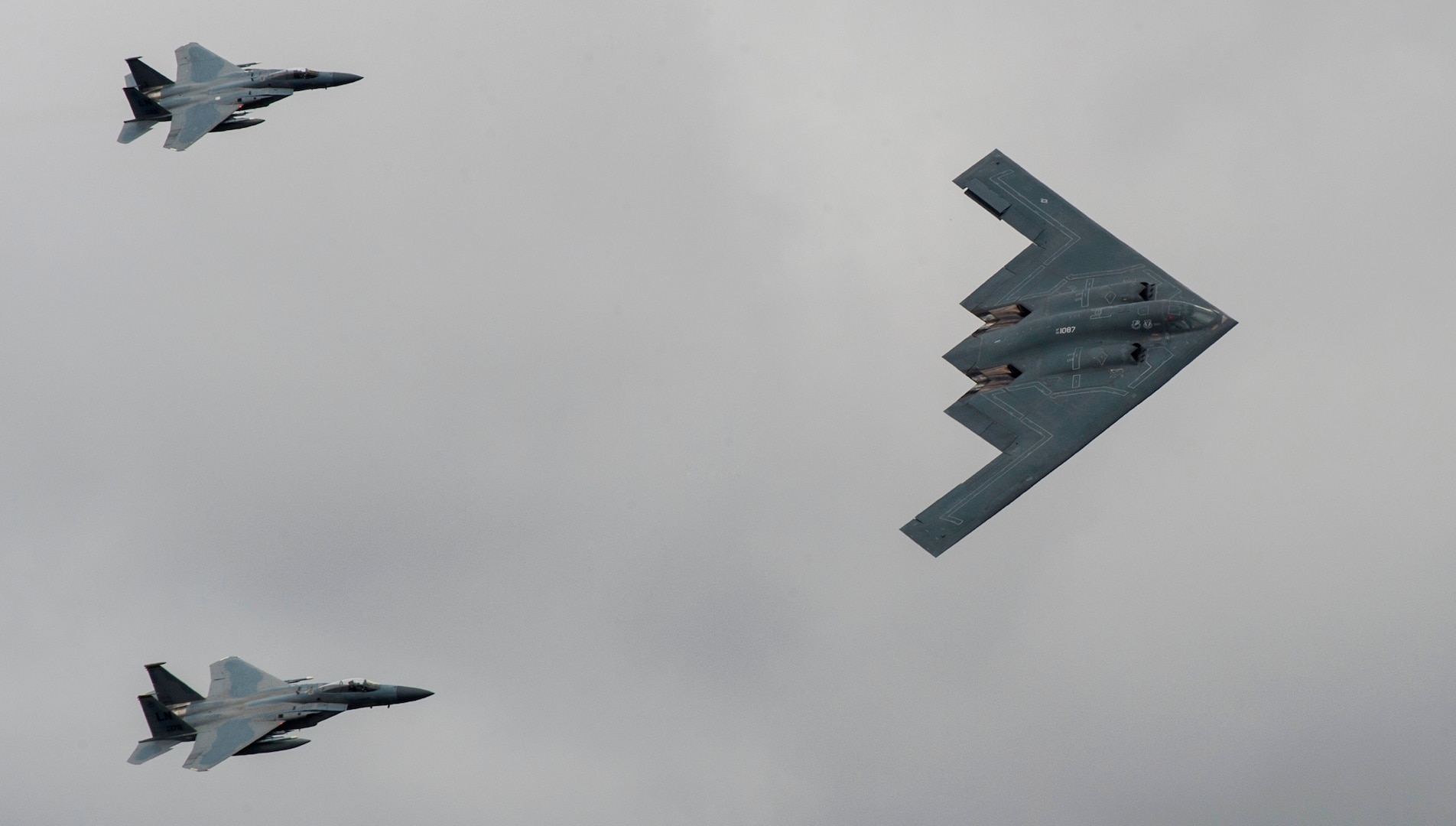 A U.S. Air Force B-2 Stealth Bomber and two F-15 Strike Eagle aircraft fly past spectators during the 2017 Royal International Air Tattoo (RIAT) located at RAF Fairford, United Kingdom, on July 16, 2017. This year commemorates the U.S. Air Force’s 70th Anniversary, which was highlighted during RIAT by displaying its lineage and advancements in military aircraft. (U.S. Air Force photo by Tech. Sgt. Brian Kimball)