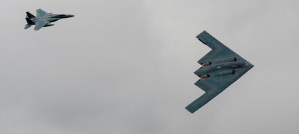 A U.S. Air Force B-2 Stealth Bomber and an F-15 Strike Eagle fly past spectators during the 2017 Royal International Air Tattoo (RIAT) located at RAF Fairford, United Kingdom, on July 16, 2017. This year commemorates the U.S. Air Force’s 70th Anniversary, which was highlighted during RIAT by displaying its lineage and advancements in military aircraft. (U.S. Air Force photo by Tech. Sgt. Brian Kimball)
