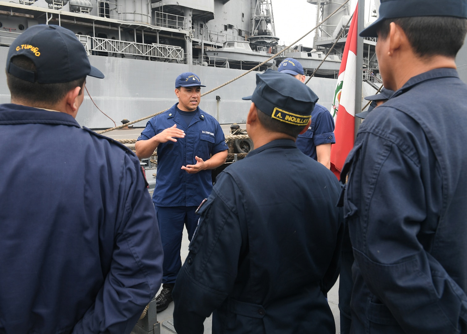 LIMA, Peru (July 16, 2917) - U.S. Coast Guard Maritime Enforcement Specialist 2nd Class Juan Leon conducts a maritime law enforcement symposium with UNITAS partner nation participants from Mexico, Peru, Honduras and Chile onboard a Peruvian naval vessel. UNITAS is an annual exercise that focuses on strengthening our existing regional partnerships and encourages establishing new relationships through the exchange of maritime mission-focused knowledge and expertise throughout the exercise. (U.S. Navy photo by Mass Communication Specialist 2nd Class Michael Hendricks/Released)