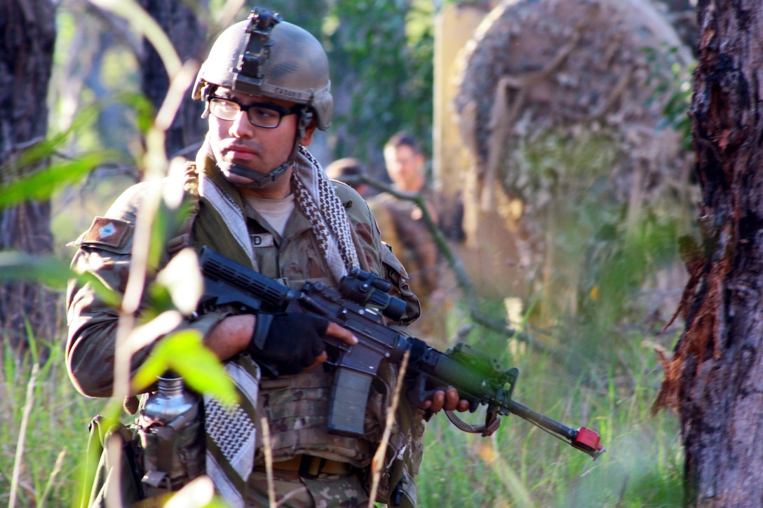 Army Spc. Mario Cadavid leads a patrol during exercise Talisman Saber at Shoalwater Bay, Queensland, Australia, July 15, 2017. Cadavid is an infantryman assigned to Headquarters and Headquarters Company, 1st Battalion, 69th Infantry Regiment of the New York Army National Guard. Army National Guard photo by Sgt. Alexander Rector

