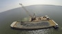 Granite rock, which is brought in by barge, is methodically placed in the Piankatank River near Gwynn’s Island in Mathews County Virginia. The rock is the basis for the newest, 25-acre oyster reef in the Chesapeake Bay Watershed. The Norfolk District, U.S. Army Corps of Engineers, is overseeing the more than $2 million sanctuary reef project in partnership with the Virginia Marine Resources Commission and the Nature Conservancy.   (U.S. Army photo/Patrick Bloodgood)