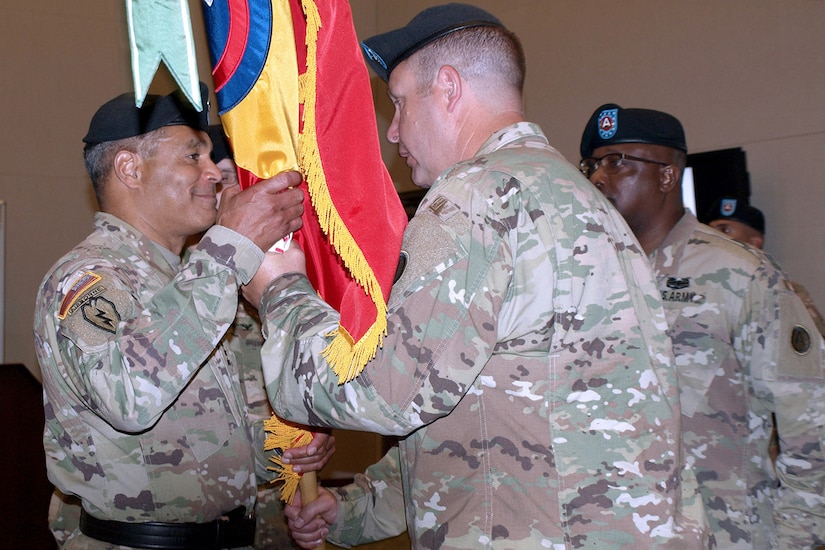 The 4th Battlefield Coordination Detachment, U.S. Army Central outgoing Commander Col. Samuel Saine, center, passes the 4th BCD's colors to Lt. Gen. Michael Garrett, USARCENT commanding general, during the 4th BCD's change of command ceremony at Patton Hall on Shaw Air Force Base, S.C., July 11, 2017. Saine relinquished his command of the detachment to Col. Geoffrey Adams, incoming commander of the 4th BCD.