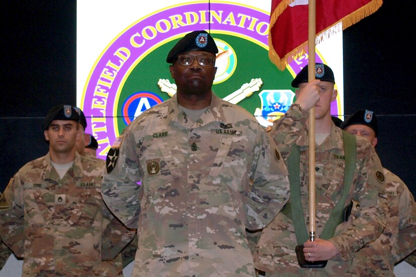 Sgt. Maj. Robert Clark, center, 4th Battlefield Coordination Detachment, U.S. Army Central, senior advisor to the commander, and 4th BDC Soldiers stand at parade rest during a change of command ceremony at Shaw Air Force Base, S.C., July 11, 2017. Col. Samuel Saine, 4th BCD outgoing commander, relinquished his command of the detachment to Col. Geoffrey Adams, 4th BCD incoming commander.