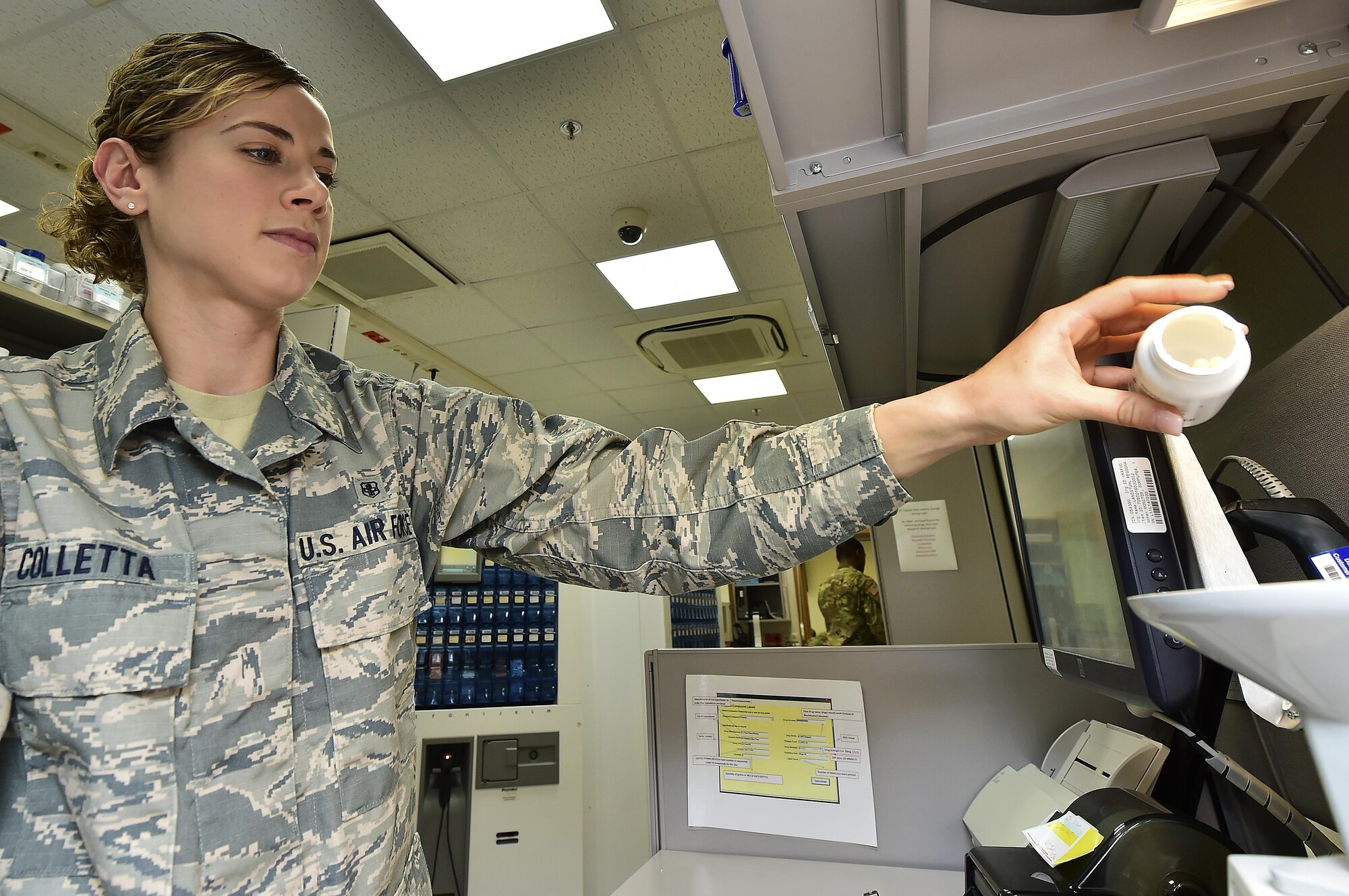 U.S. Air Force Senior Airman Lesley Colletta, 86th Medical Squadron pharmacy technician, pours medicine into a pill counter at Landstuhl Regional Medical Center, Germany, July 13, 2017. Colletta’s efforts as a pharmacy technician saved the life of an infant earlier this year after she recognized a medical error and spoke up about a wrong dosing of the medication. Air Force Medical Service recognized Colletta as a Trusted Care Hero. (U.S. Air Force photo by Staff Sgt. Jonathan Bass)