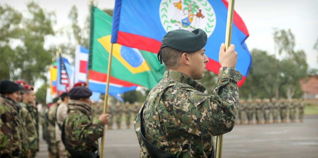 Multinational special forces teams line up at the opening ceremony for Fuerzas Comando 2017 in Mariano Roque Alonso, Paraguay on July 17, 2017. Fuerzas Comando is a fellowship program that promotes military-to-military relationships for all teams involved. (U.S. Army photo by Sgt. Christine Lorenz/Released)