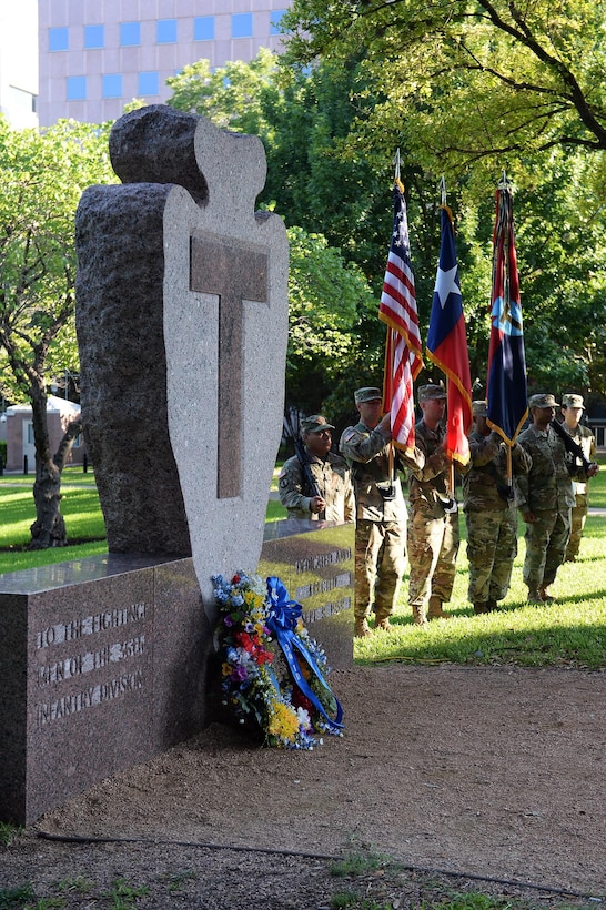 The 36th Infantry Division's color guard stands next to a unit memorial during a ceremony that commemorated the division's 100th anniversary in Austin, Texas, July 15, 2017. Army National Guard photo by Sgt. Michael Giles