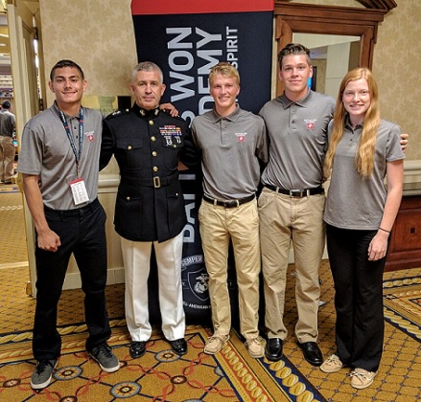 Maj. Gen. Paul Kennedy, commanding general, Marine Corps Recruiting Command, poses for a photo with Semper Fidelis All-Americans Mateo Grub, Colin Williams, Michael Lunny and Lauren Wallace following the capstone banquet of the Battles Won Academy July 16, 2017. The students were selected to attend the three-day kinetic leadership seminar in Washington from nearly 1,000 nominations, based on their fighting spirit, outstanding character, academic accomplishment and athleticism. These students hail from all four corners of the country; Seattle; Fort Lauderdale, Florida; Portsmouth, New Hampshire; and San Francisco.