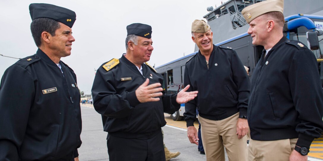 CALLAO, Peru (July 16, 2017) Peruvian navy Rear Adm. Alberto Alcala, commander, Surface Force Peru, left, Vice Adm. Fernando Cerdan, commander general of Pacific Operations, left center, Rear Adm. Sean S. Buck, commander, U.S. Naval Forces Southern Command/U.S. 4th Fleet, left center, and Master Chief Petty Officer of the Navy Steven S. Giordano, meet during an international cuisine festival as part of UNITAS 2017. (U.S. Navy photo by Mass Communication Specialist 2nd Class Bill Dodge/Released)