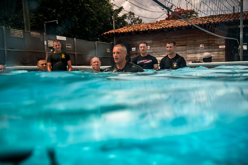 U.S. Marines with Special Purpose Marine Air-Ground Task Force – Southern Command conduct water survival training with U.S. Army soldiers from JTF-Bravo Medical Element at Soto Cano Air Base, June 13, 2017. This week-long training class went over different survival techniques, swimming tips, uniform flotation methods and physical training. (U.S. Air National Guard photo by Master Sgt. Scott Thompson/released)