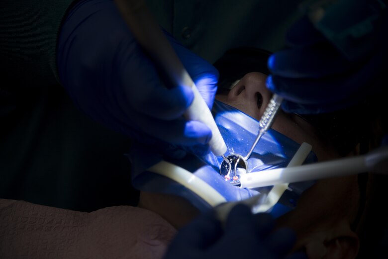 Camera to microscope Airman plants roots for Air Force career