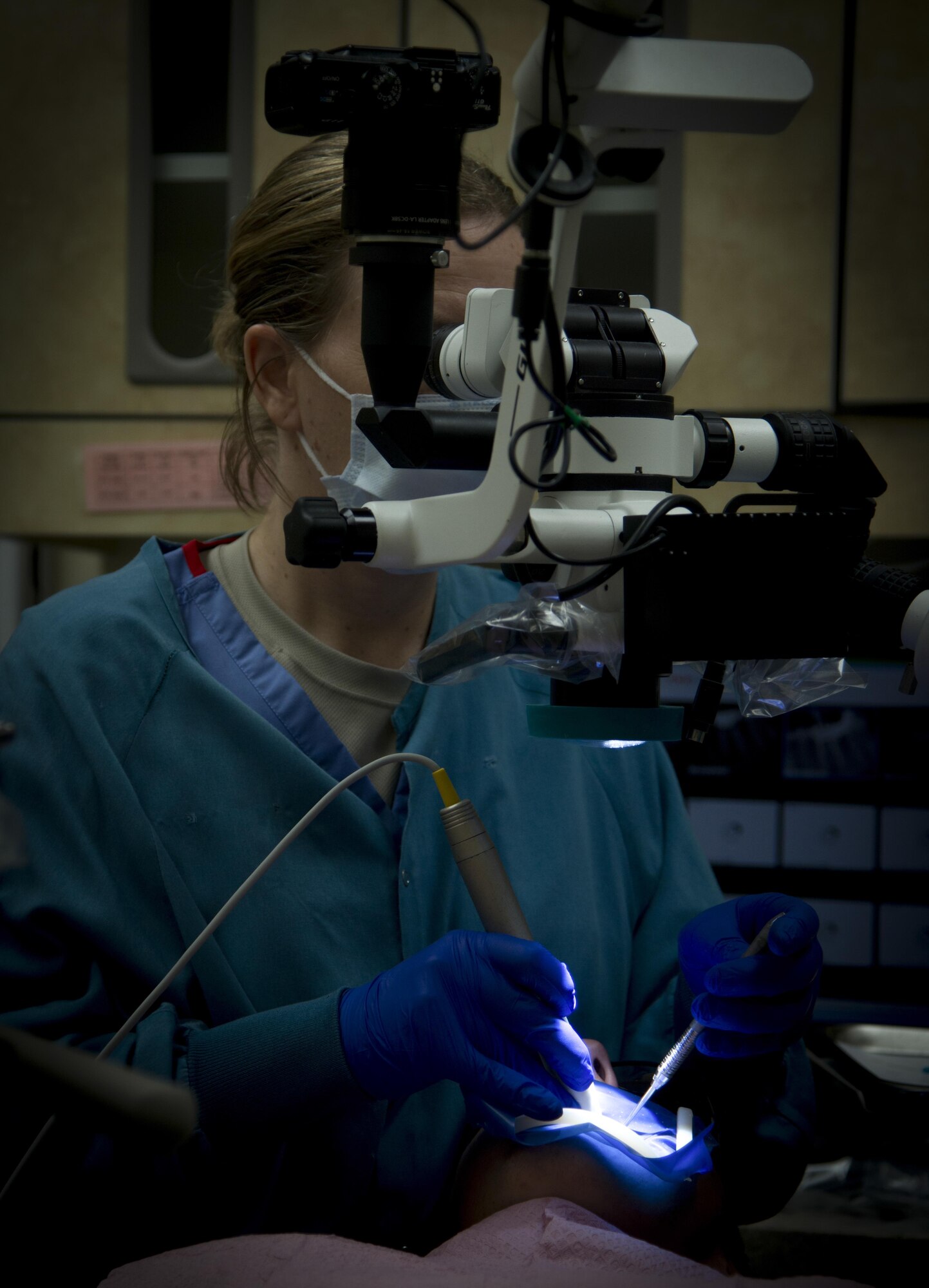 U.S. Air Force Maj. Kelly Ramey, an endodontist assigned to the 6th Dental Squadron, works on a root canal at MacDill Air Force Base, Florida, July 11, 2017. Ramey found her passion for dentistry after visiting a dental clinic during a tour. (U.S. Air Force photo by Senior Airman Mariette Adams)