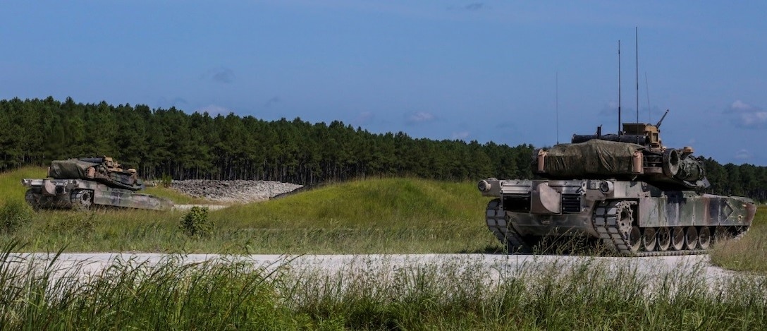 M1A1 Abrams battle tanks scan for targets during a combined arms range for Iron Wolf 17 at Camp Lejeune, N.C., July 14, 2017. Iron Wolf 17 is a multi-unit exercise designed to simulate battlefield conditions Marines may face while deployed. The tanks are from 2nd Tank Battalion, 2nd Marine Division. (United States Marine Corps photo by Cpl. Jon Sosner)