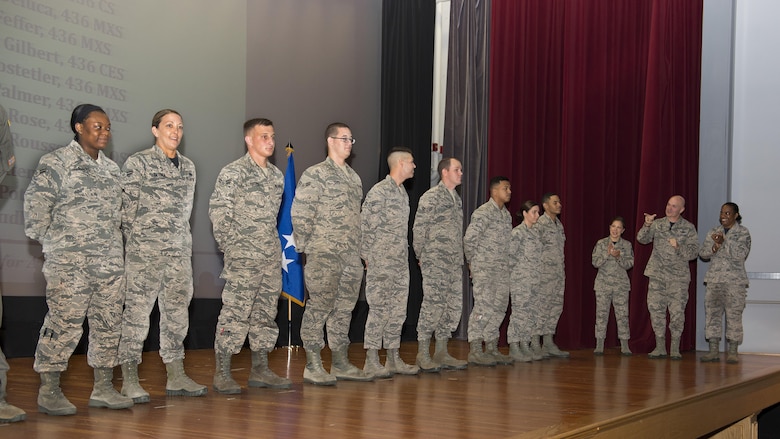 Gen. Carlton D. Everhart II, Air Mobility Command commander, and Chief Master Sgt. Shelina Frey, AMC command chief, surprise 11 Airmen with Below-the-Zone senior airman promotions July 14, 2017, at Dover Air Force Base, Del. These promotions allow the Airman to promote six months early. (U.S. Air Force photo by Senior Airman Zachary Cacicia)