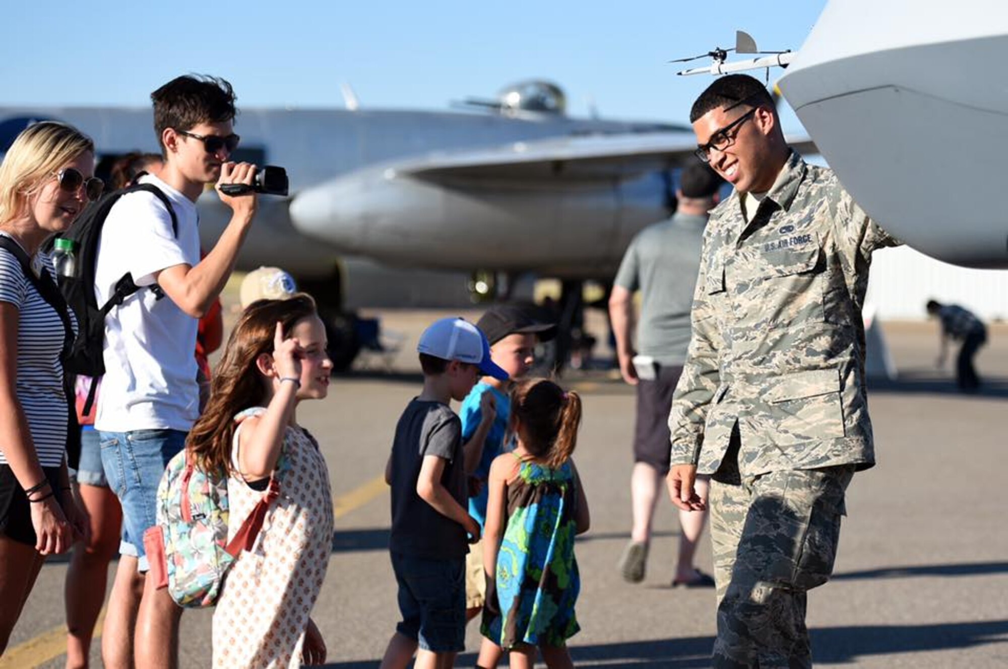 Senior Airman Benjamin, 432nd Aircraft Maintenance Squadron avionics journeyman, brief Canadian citizens at the Lethbridge International Air Show July 14-16, 2017, in Alberta, Canada. The MQ-9 Reaper was on display as part of the partnership efforts between the U.S. and Canada. Throughout the three day event, Airmen briefed spectators on the Reaper's multi-role capabilities, its maintenance and munitions specifications and explained the differences between a drone and a remotely piloted aircraft. (U.S. Air Force photo/Master Sgt. Nadine Barclay)
