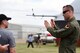 1st Lt. Daniel, 432nd WG pilot, explains the mission sets of the MQ-9 Reaper to Canadian residents at the Lethbridge International Air Show July 14-16, 2017, in Alberta, Canada. During the event, Canada residents asked many questions regarding the capabilities of the aircraft, but most were surprised by the multi-role platform and its various uses. 
 (U.S. Air Force photo/Master Sgt. Nadine Barclay)
