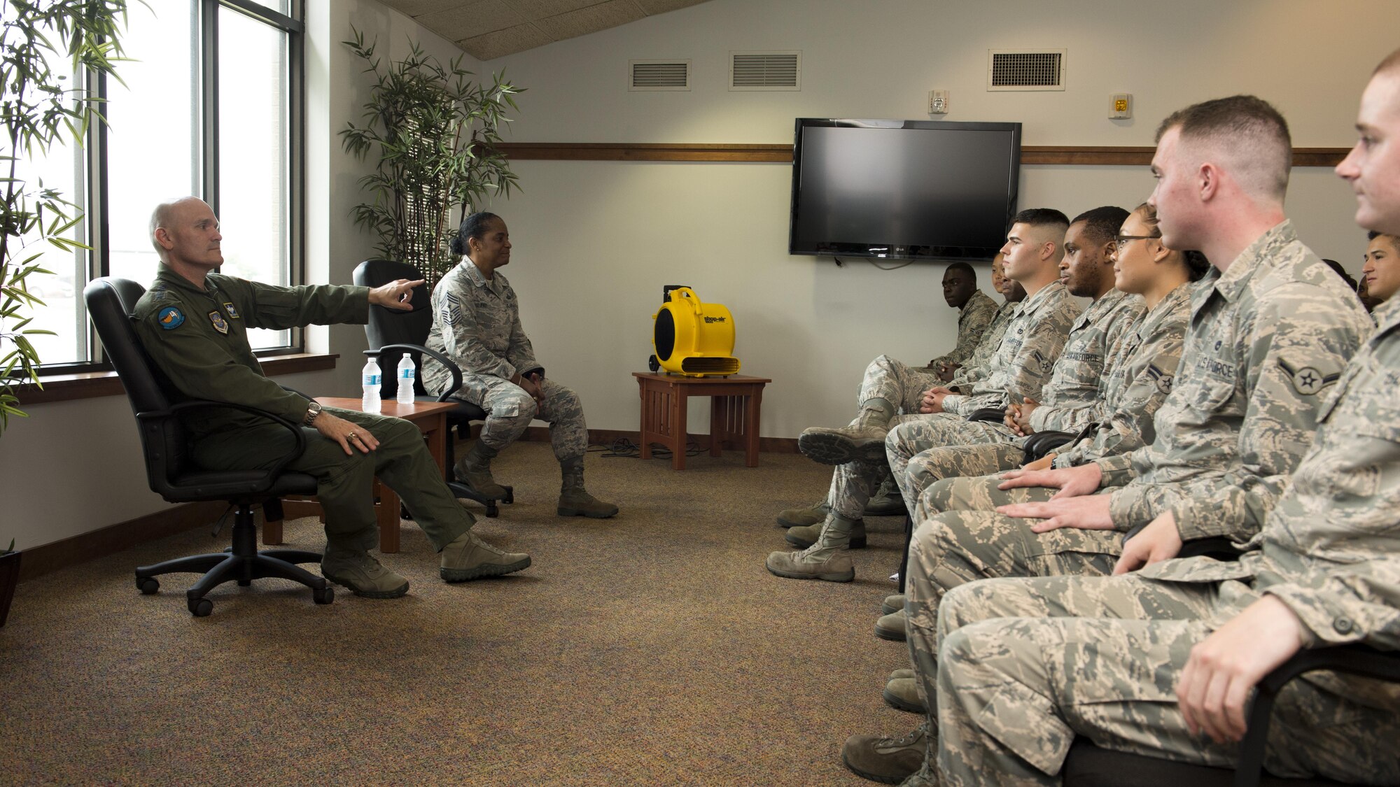 Gen. Carlton D. Everhart II, Air Mobility Command commander, and Chief Master Sgt. Shelina Frey, AMC command chief, meet with Team Dover Airmen who live in the base dormitories, July 13, 2017, at Dover Air Force Base, Del. This meeting allowed the Airmen to speak candidly with Everhart and Frey on their needs as Airmen. (U.S. Air Force photo by Senior Airman Zachary Cacicia)