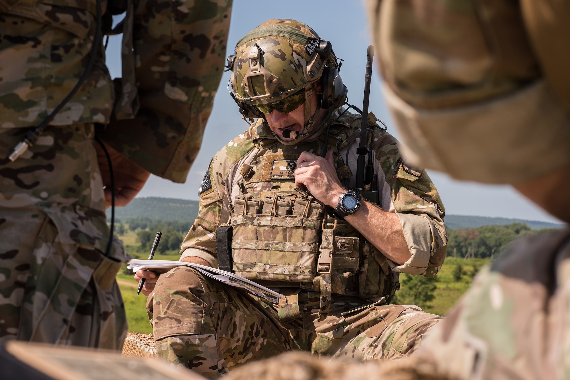 Capt. Christopher Cadieux, a 146th Air Support Operations Squadron air liaison officer from Will Rogers Air National Guard Base, Oklahoma City, calls in coordinates during a training event at Razorback Range, Fort Chaffee Maneuver Training Center in Fort Smith, Ark., and Hog Military Operating Area, Mansfield, Ark., July 11, 2017. The close air support training event, called Sooner Strike, was coordinated by the 146 ASOS and enabled Airmen in the air and on the ground to share techniques and accomplish both mission qualification training and continuation training with several aircraft common to TACP missions. (U.S Air National Guard photo by Senior Master Sgt. Andrew M. LaMoreaux)