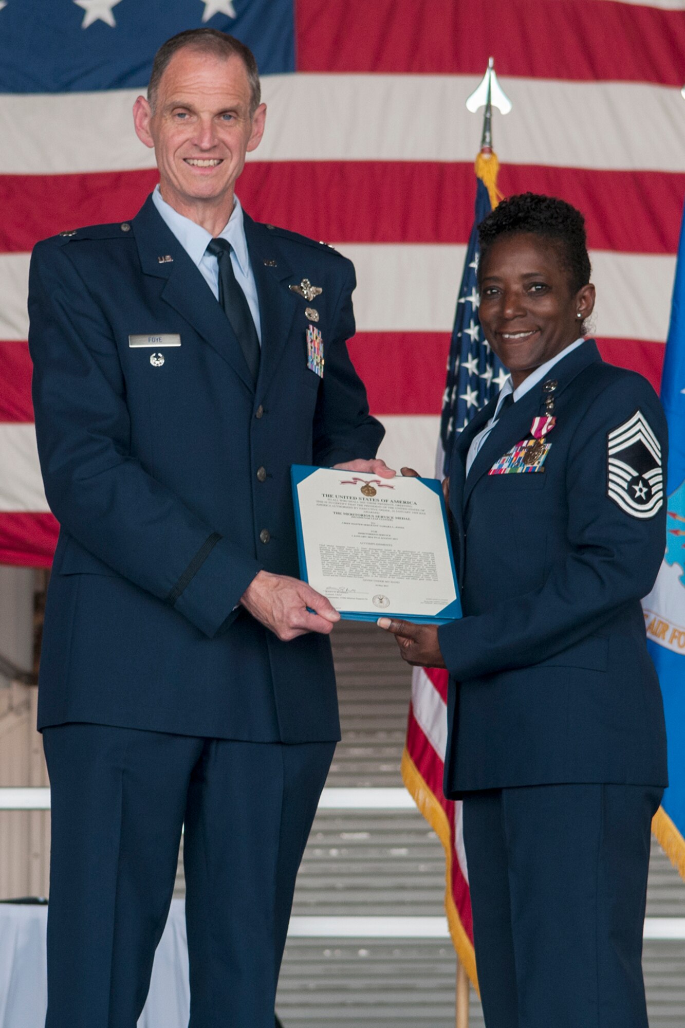 Lt. Col. Martin Foye (retired) and Chief Master Sgt. Tamara Jones, 434th Logistics Readiness Squadron superintendent, pose during Jones’ retirement ceremony at Grissom Air Reserve Base, Ind. July 8, 2017. Jones has been a member of the Air Force for 33 years. (U.S. Air Force photo/Staff Sgt. Dakota Bergl)