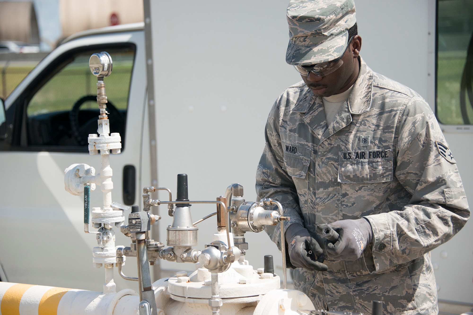 Senior Airman Darnell Ward, 919th Special Operations Civil Engineer Squadron, calibrates the automatic control valve on the fuel line at Eglin Air Force Base, Fla.,July 8, 2017. The fuel line controls the pressure and rate at which fuel is transferred from the storage tanks to vehicles which service aircraft arriving and departing the base. The tests ensure there is no damage to aircraft or refueling vehicles due to tanks being over pressurized. (Air Force photo/Lt. Col. James R. Wilson)