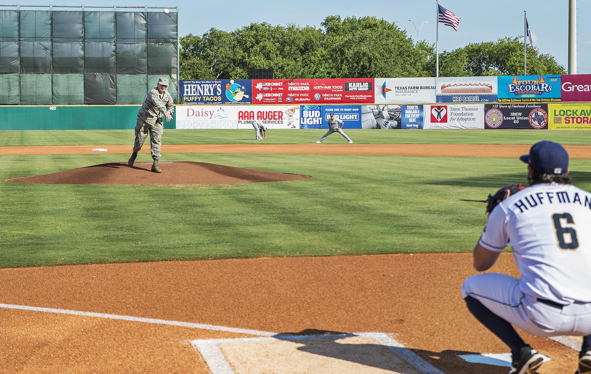 Col. Thomas K. Smith, Jr., 433rd Airlift Wing commander, throws out the first pitch during the San Antonio Missions baseball game July 16, 2017 at Nelson Wolff Stadium.  (U.S. Air Force photo by Benjamin Faske)