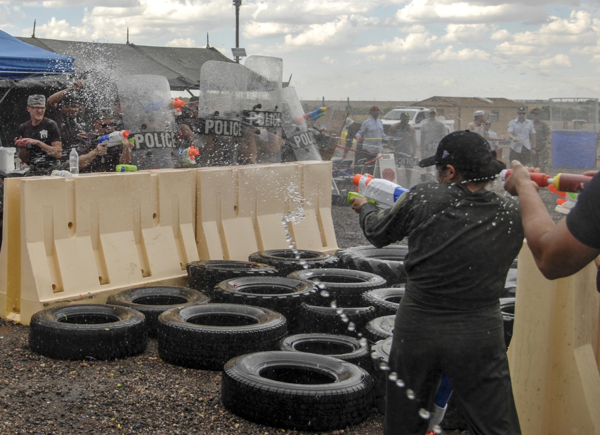 Team Buckley members enjoy a Combat Dining Out hosted July 14, 2017, at Camp Rattlesnake on Buckley Air Force Base, Colo. The Combat Dining Out paid tribute to 70 years of Air Force History, while giving members an opportunity to build morale and esprit de corps with their fellow wingmen. (U.S. Air Force photo by Tech. Sgt. Nicholas Rau)