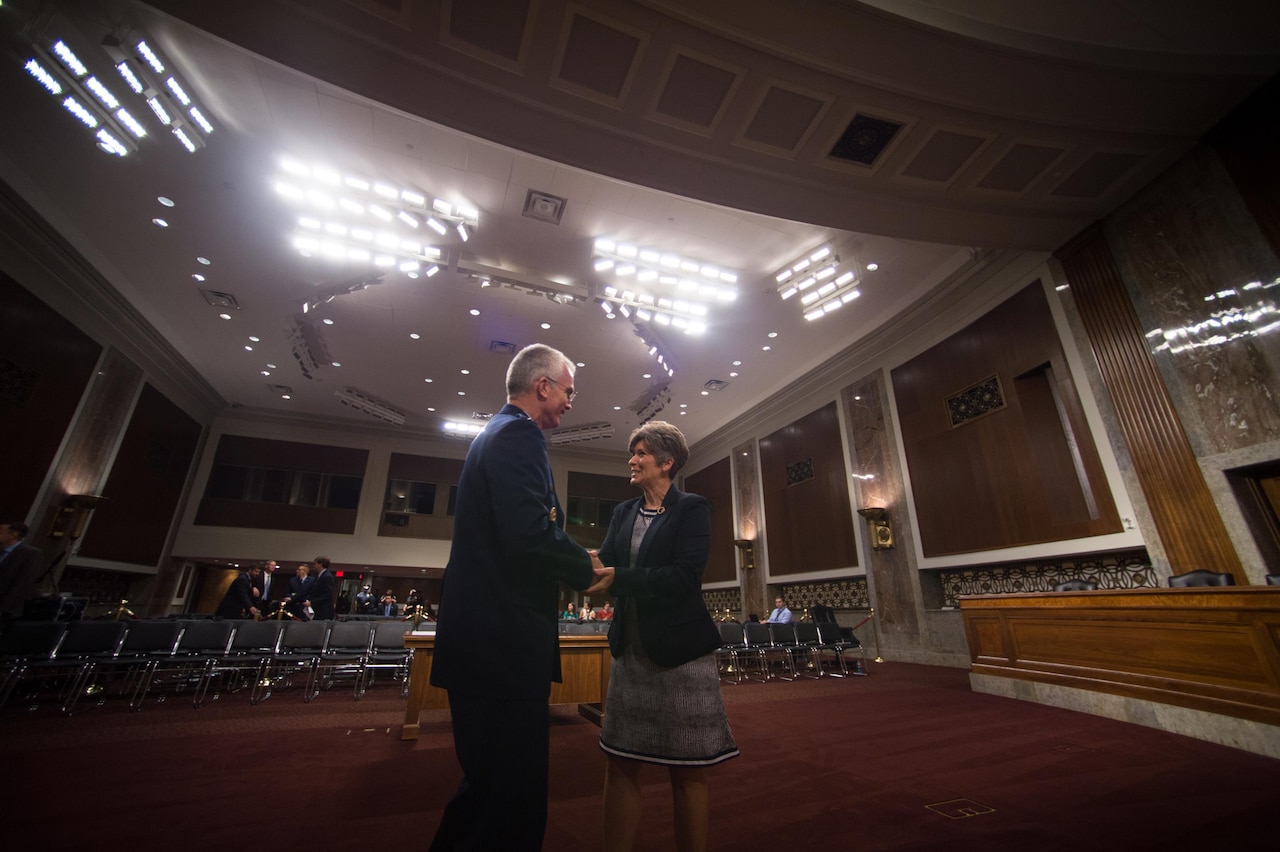 U.S. Air Force Gen. Paul J. Selva, Vice Chairman of the Joint Chiefs of Staff, greets Sen. Joni Ernst before testifying during a Senate Armed Services Committee hearing on Capitol Hill in Washington, July 18, 2017. The hearing was held to consider Gen. Selva’s reappointment to the grade of general and as the Vice Chairman. (DoD Photo by U.S. Army Sgt. James K. McCann)