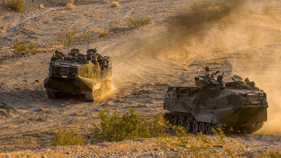 Marines drive amphibious assault vehicles across the desert at Marine Air Ground Combat Center Twentynine Palms, Calif., July 15, 2017. The Marines, assigned to the 2nd Battalion, 7th Marine Regiment, were preparing for a deployment. Marine Corps photo by Cpl. Justin Huffty