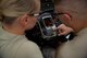 Staff Sgt. Jonathan Medler explains to Senior Airman Devon Posey, both 932nd Aerospace Ground Equipment technicians, how to check the measurements on the burner of a New Generation Heater and the significance to having correct measurements July 8, 2017, Scott Air Force Base, Illinois. (U.S. Air Force photo by Tech. Sgt. Christopher Parr)
