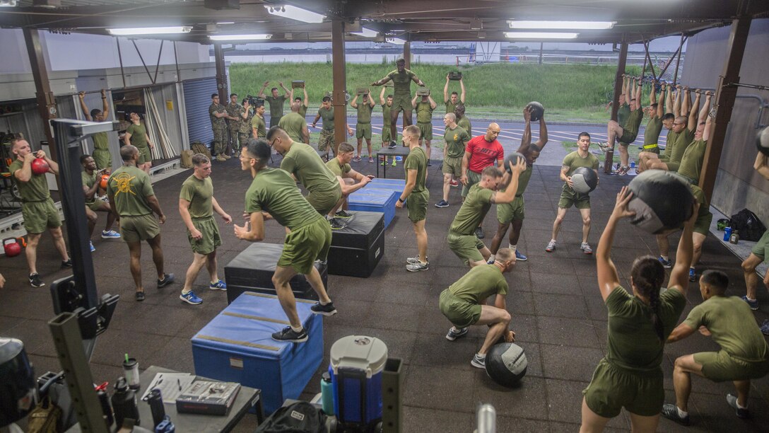 Marines participate in a physical fitness training session at Marine Corps Air Station Iwakuni, Japan, July 18, 2017. The Marines are assigned to Marine Aircraft Group 12. Marine Corps photo by Lance Cpl. Carlos Jimenez