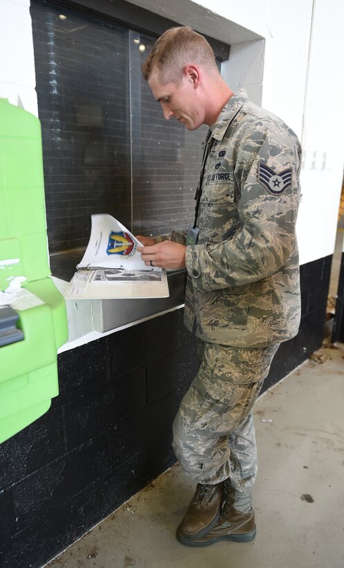 U.S. Air Force Staff Sgt. Rhebb Hulett, 7th Bomb Wing operational safety technician, reviews a safety checklist during a facility inspection at Dyess Air Force Base, Texas, July 10, 2017. The 7th BW safety office occupational division oversees all occupational safety policy, programs and procedures to provide a safe work environment and enhance the safety of the Air Force personnel while on and off duty to help maintain combat capability and readiness. (U.S. Air Force photo by Airman 1st Class Emily Copeland)