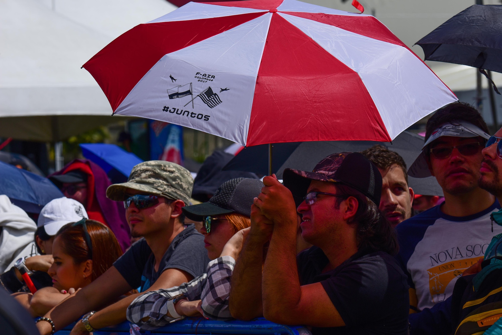 Guests watch the aerial demonstrations at José María Córdova International Airport during Feria Aeronautica Internacional—Colombia 2017 in Rionegro, Colombia, July 15, 2017. The United States Air Force is participating in the four-day air show with two South Carolina Air National Guard F-16s as static displays, plus static displays of a KC-135, KC-10, along with an F-16 aerial demonstration by the Air Combat Command’s Viper East Demo Team.  United States military participation in the air show provides an opportunity to strengthen our military-to-military relationships with regional partners and provides the opportunity to meet with our Colombian air force counterparts and facilitate interoperability, which can be exercised in future cooperation events such as exercises and training. (U.S. Air National Guard photo by Senior Airman Megan Floyd)