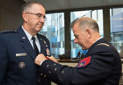 U.S. Air Force Gen. John E. Hyten, commander of U.S. Strategic Command (USSTRATCOM), receives the French Legion of Honor from Adm. Phillippe Coindreau, French Vice Chief of Defence, in Paris, July 12, 2017. Hyten was honored with the award while in Europe, as he worked to deepen relationships with senior U.S. and allied military leaders and better integrate USSTRATCOM capabilities with other U.S. combatant commands.