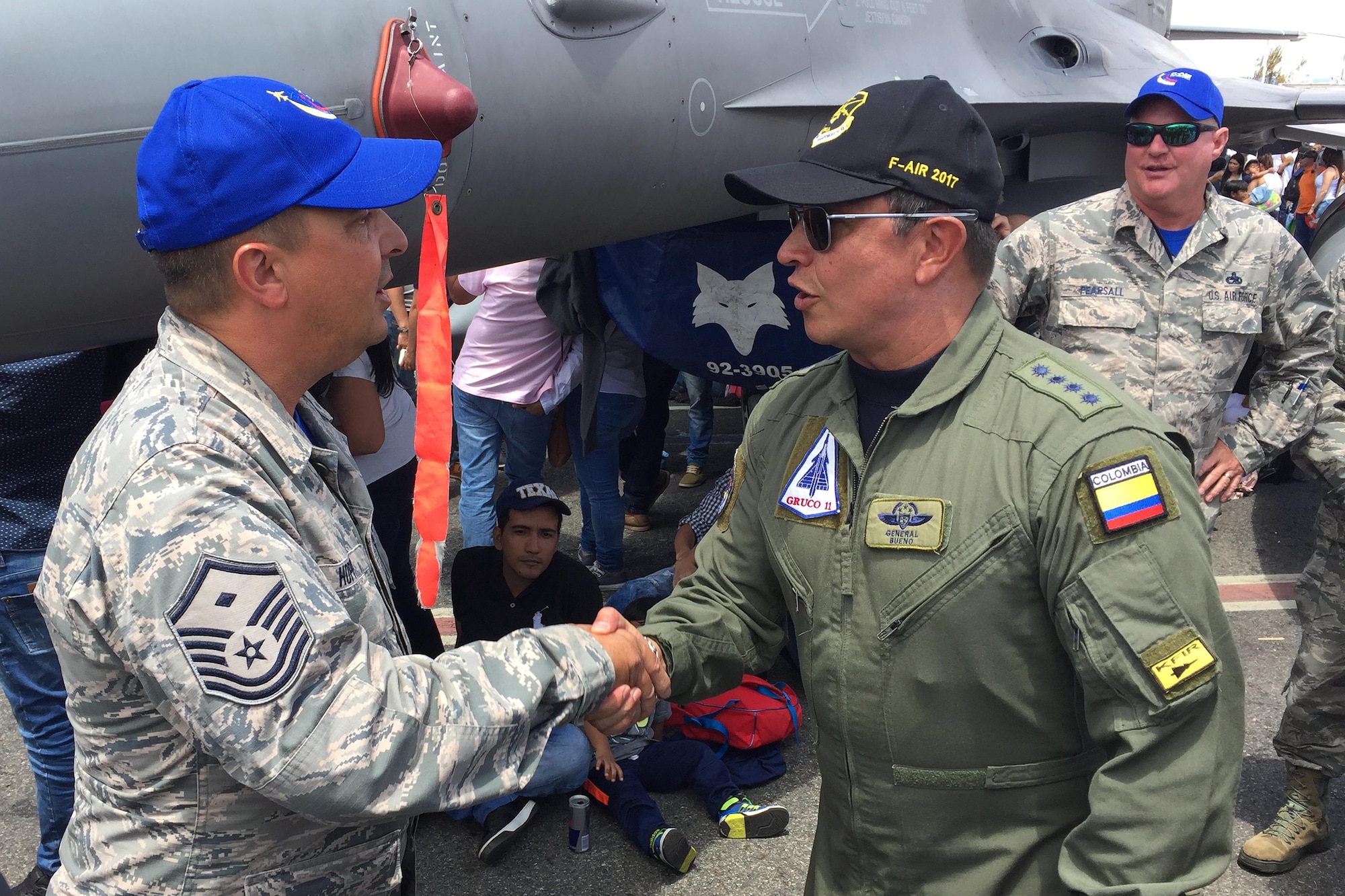 Colombian Air Force Gen. Carlos Bueno (right) speaks to Master Sgt. Jeff Hopper, during the Force’s Feria Aeronautica Internaccional – Colombia in Rionegro. Bueno thanked Airmen of the South Carolina Air National Guard’s 169th Fighter Wing for their support during the air show, July 16, 2017. The United States Air Force participated in the four-day air and trade show providing static displays of various aircraft to include the F-16, KC-10 and KC-135. During the air show the Air Combat Team’s Viper East Demo Team performed daily and a B-52 from US Strategic Command performed a flyover. The United States military participation in the air show provides an opportunity to strengthen our military-to-military relationships with regional partners and provides the opportunity to meet with Colombian air force counterparts. (U.S. Air National Guard photo by Capt. Stephen D. Hudson).