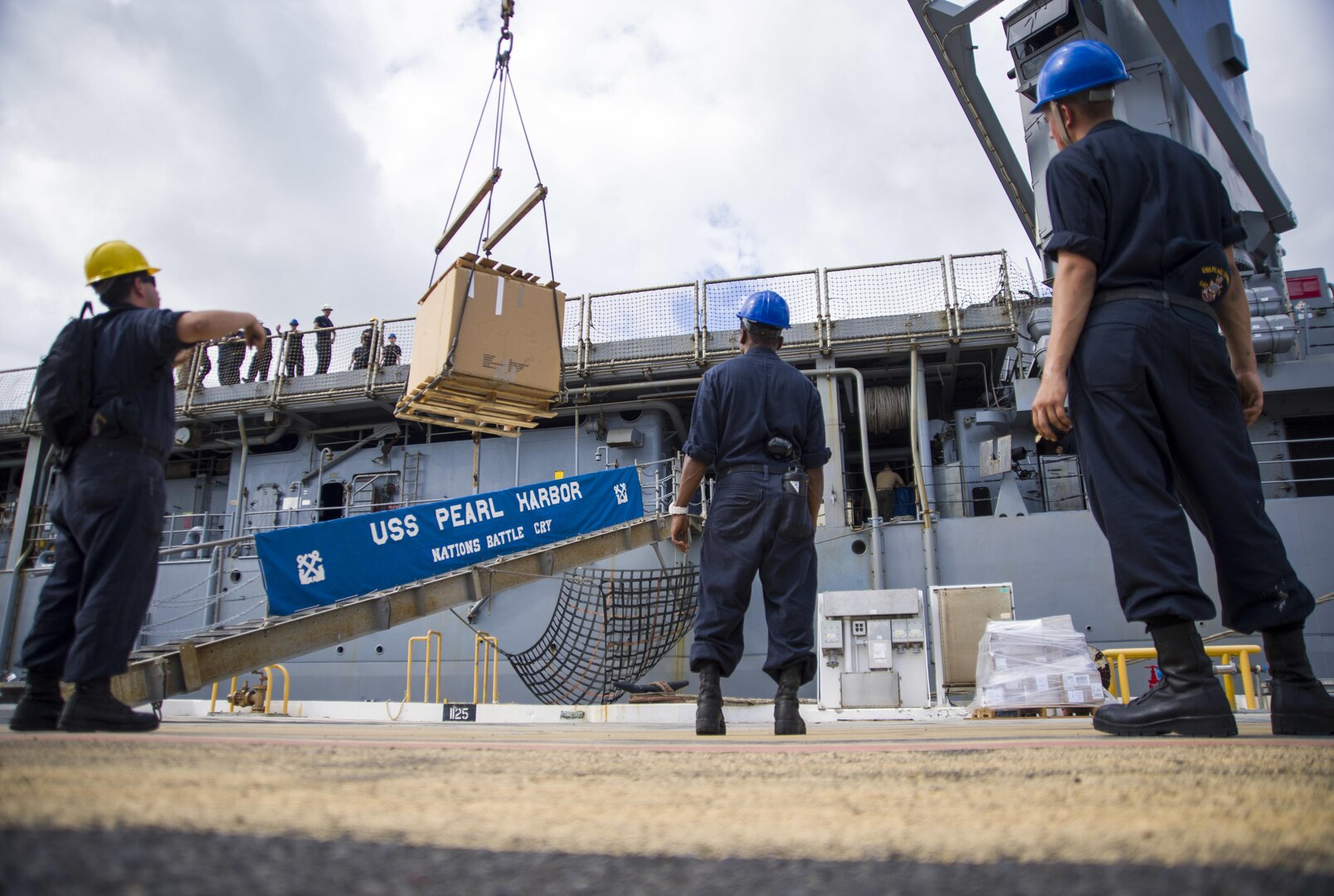 170607-N-NU281-0129 PEARL HARBOR (July 14, 2017) Sailors assigned to amphibious dock landing ship USS Pearl Harbor (LSD 52) load supplies while moored at Joint Base Pearl Harbor-Hickam during a port visit to its namesake, July 14, before returning to its homeport in San Diego. The ship arrived on the eve of the commissioning ceremony of future USS John Finn (DDG 113) to help honor its official arrival into the U.S. Navy fleet. (U.S. Navy photo by MC3 Justin R. Pacheco)