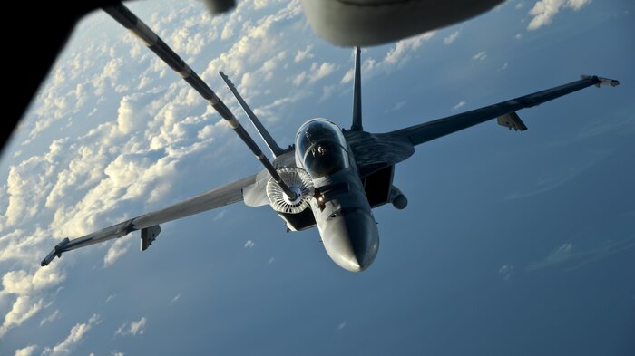 A KC-10 Extender from Travis Air Force Base, California, refuels a U.S. Navy F/A-18 Super Hornet over the Pacific Ocean July 14, 2017. KC-10s from Travis AFB supported Exercise Talisman Saber 2017 by conducting various air refueling missions over Australia. TS17 is a biennial exercise in Australia that focuses on bilateral military training between U.S. Pacific Command forces and the Australian Defence Force to improve U.S.-Australia combat readiness, increase interoperability, maximize combined training opportunities and conduct maritime prepositioning and logistics operations in the Pacific. (U.S. Air Force photo by 2nd Lt. Sarah Johnson)