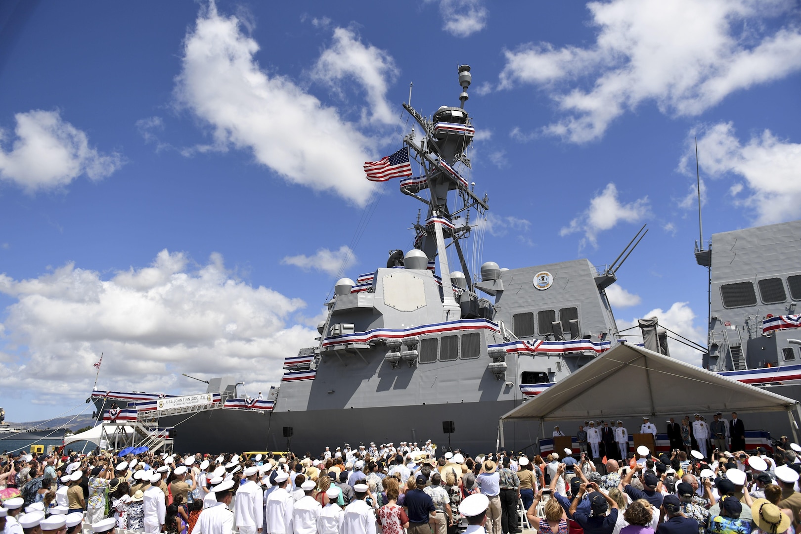 170715-N-WM477-0118 -- PEARL HARBOR (July 15, 2017) The crew of the Navy's newest Arleigh Burke-class guided-missile destroyer, USS John Finn (DDG 113) brings the ship to life during its commissioning ceremony. DDG 113 is named in honor of Lt. John William Finn, who as a chief aviation ordnanceman was the first member of our armed services to earn the Medal of Honor during World War II for heroism during the attack on Pearl Harbor. (U.S. Navy Photo by Mass Communication Specialist Aiyana Paschal)