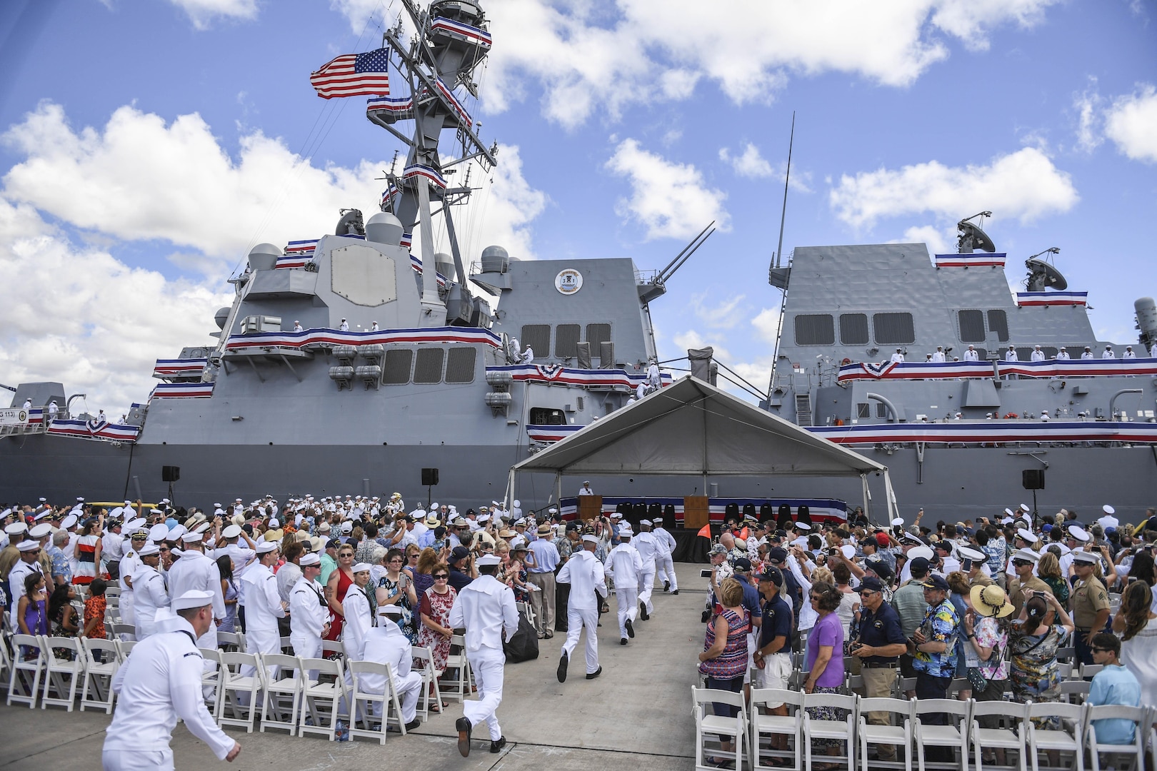 170715-N-WM477-0173 -- PEARL HARBOR (July 15, 2017) The crew of the Navy's newest Arleigh Burke-class guided-missile destroyer, USS John Finn (DDG 113) brings the ship to life during its commissioning ceremony. DDG 113 is named in honor of Lt. John William Finn, who as a chief aviation ordnanceman was the first member of our armed services to earn the Medal of Honor during World War II for heroism during the attack on Pearl Harbor. (U.S. Navy Photo by Mass Communication Specialist Aiyana Paschal)