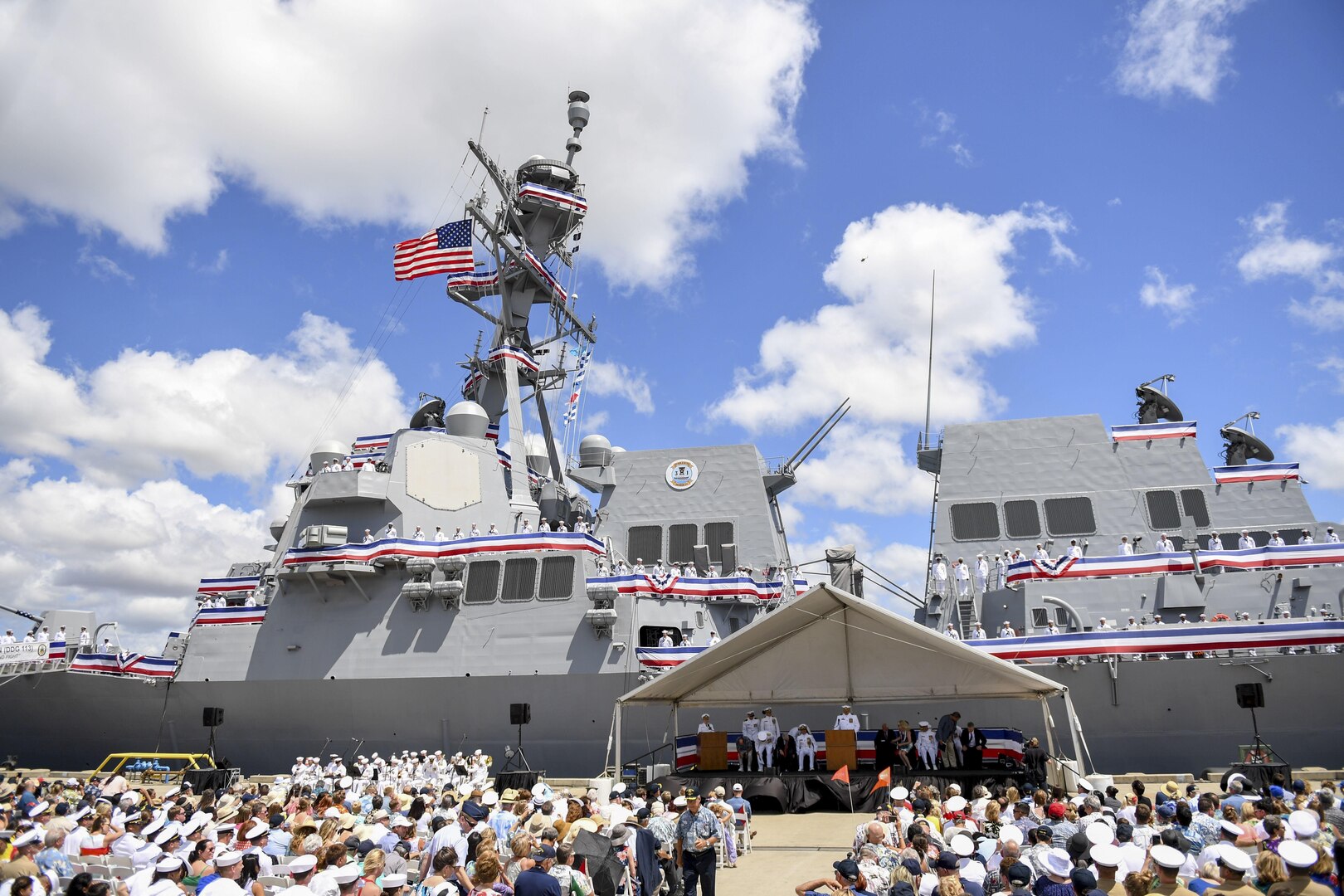 170715-N-WM477-0233 -- PEARL HARBOR (July 15, 2017) The crew of the Navy's newest Arleigh Burke-class guided-missile destroyer, USS John Finn (DDG 113) brings the ship to life during its commissioning ceremony. DDG 113 is named in honor of Lt. John William Finn, who as a chief aviation ordnanceman was the first member of our armed services to earn the Medal of Honor during World War II for heroism during the attack on Pearl Harbor. (U.S. Navy Photo by Mass Communication Specialist Aiyana Paschal)