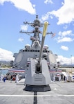 170715-N-WM477-0279 -- PEARL HARBOR (July 15, 2017) Sailors and civilians stand aboard the fo’c’sle of Navy's newest Arleigh Burke-class guided-missile destroyer, USS John Finn (DDG 113) during the reception of its commissioning ceremony. DDG 113 is named in honor of Lt. John William Finn, who as a chief aviation ordnanceman was the first member of our armed services to earn the Medal of Honor during World War II for heroism during the attack on Pearl Harbor. (U.S. Navy Photo by Mass Communication Specialist Aiyana Paschal)