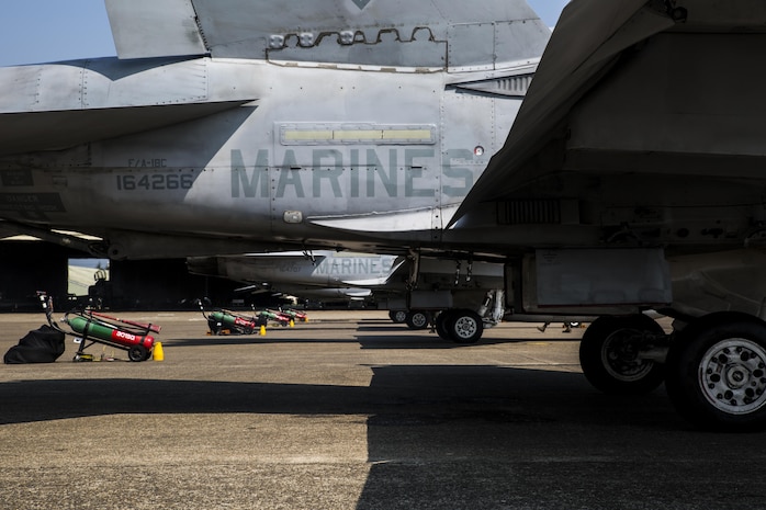 U.S. Marine Corps F/A-18C Hornets with Marine Fighter Attack Squadron (VMFA) 232 are fired up as they prepare to take off at Japan Air Self-Defense Force (JASDF) Hyakuri Air Base, Japan, July 10, 2017. VMFA-232 has been conducting exercises with the JASDF as part of the Aviation Training Relocation program, which is designed to increase operational readiness and interoperability between U.S. and Japanese forces. (U.S. Marine Corps photo by Lance Cpl. Mason Roy)