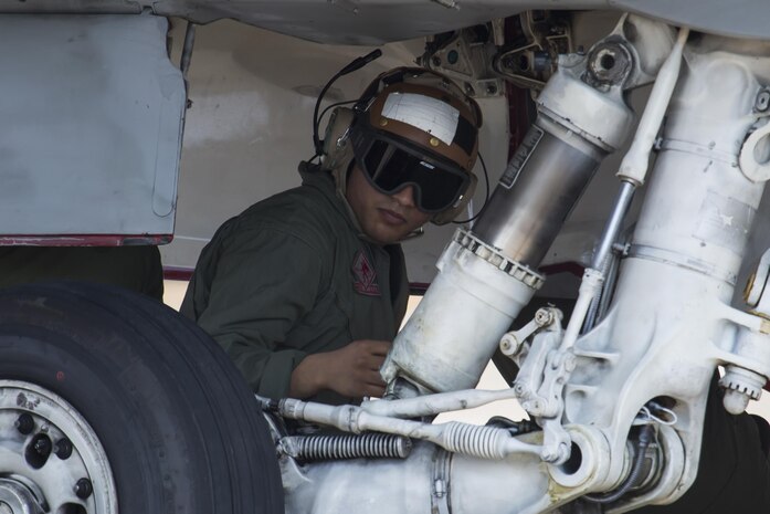 U.S. Marine Corps Sgt. Parth Patel, collateral duty inspector with Marine Corps Fighter Attack Squadron (VMFA) 232, inspects an F/A-18C Hornet before takeoff at Japan Air Self-Defense Force (JASDF) Hyakuri Air Base, Japan, July 10, 2017. VMFA-232 has been conducting exercises with the JASDF as part of the Aviation Training Relocation program, which is designed to increase operational readiness and interoperability between U.S. and Japanese forces. The squadron plans to enhance proficiency in dissimilar basic fighter section engaged maneuvers, active air defense and air interdictions, as well as conduct fighter attack instructor work-ups, and weapons and tactics instructor prerequisites. (U.S. Marine Corps photo by Lance Cpl. Mason Roy)
