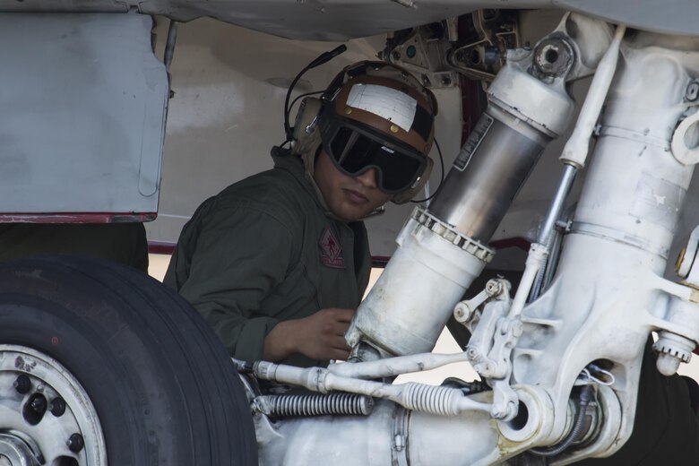 U.S. Marine Corps Sgt. Parth Patel, collateral duty inspector with Marine Corps Fighter Attack Squadron (VMFA) 232, inspects an F/A-18C Hornet before takeoff at Japan Air Self-Defense Force (JASDF) Hyakuri Air Base, Japan, July 10, 2017. VMFA-232 has been conducting exercises with the JASDF as part of the Aviation Training Relocation program, which is designed to increase operational readiness and interoperability between U.S. and Japanese forces. The squadron plans to enhance proficiency in dissimilar basic fighter section engaged maneuvers, active air defense and air interdictions, as well as conduct fighter attack instructor work-ups, and weapons and tactics instructor prerequisites. (U.S. Marine Corps photo by Lance Cpl. Mason Roy)