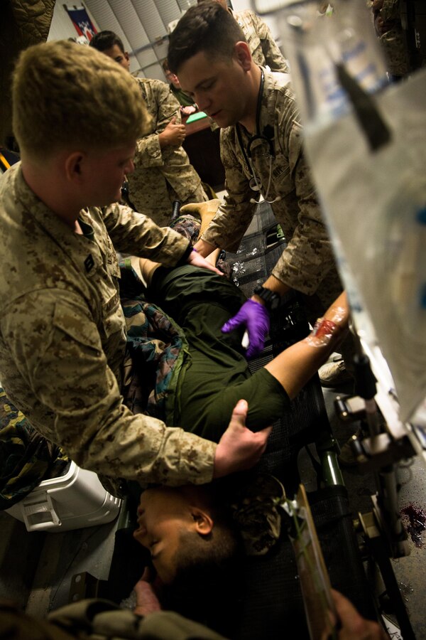 U.S. Navy corpsman assigned to Marine Air-Ground Task Force-8 (MAGTF) conduct a heat casualty drill during Integrated Training Exercise (ITX) 5-17 on Camp Wilson, Twentynine Palms, Calif., July 15, 2017. The purpose of ITX is to create a challenging, realistic training enviroment that produces combat-ready forces capable of operating as an integrated MAGTF. (U.S. Marine Corps photo by Cpl. Christopher A. Mendoza)