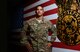 U.S. Air Force Staff Sgt. Viniegra, a fire protection specialist  assigned to the 407th Expeditionary Civil Engineer Squadron, stands next to a wooden mural in his firehouse at the 407th Air Expeditionary Group in Southwest Asia July 17, 2017. Viniegra made the mural which hangs proudly in fire station 2. (U.S. Air Force photo by Tech. Sgt. Andy M. Kin) 