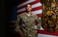 U.S. Air Force Staff Sgt. Viniegra, a fire protection specialist  assigned to the 407th Expeditionary Civil Engineer Squadron, stands next to a wooden mural in his firehouse at the 407th Air Expeditionary Group in Southwest Asia July 17, 2017. Viniegra made the mural which hangs proudly in fire station 2. (U.S. Air Force photo by Tech. Sgt. Andy M. Kin) 