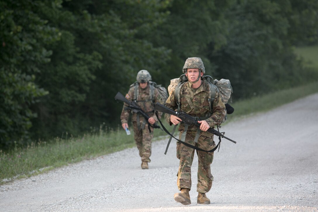 Army Pfc. Robert Nelson, foreground, does a 12-mile ruck march at Camp Atterbury, Ind., July 17, 2017, during the 2017 Army Materiel Command's Best Warrior Competition. Nelson is assigned to the 687th Rapid Port Opening Element. Soldiers are tested on basic and advanced warrior tasks and drills during the three-day competition. Army photo by Sgt. 1st Class Teddy Wade 